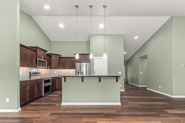 kitchen featuring a kitchen island with sink, high vaulted ceiling, stainless steel appliances, and dark brown cabinets