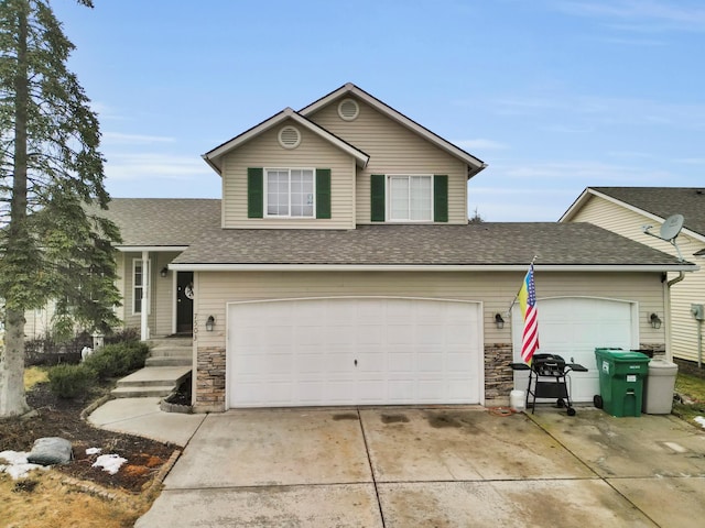 view of front of home with stone siding, a shingled roof, and concrete driveway