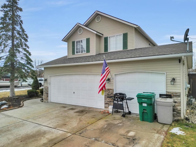 garage featuring driveway