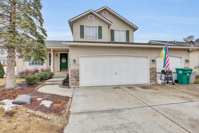 view of front facade with a garage, stone siding, and concrete driveway