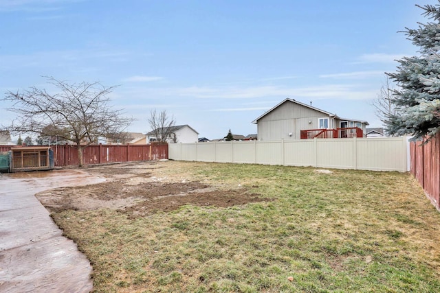 view of yard with a fenced backyard