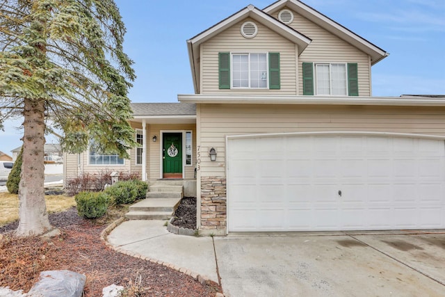 traditional home featuring a garage and driveway