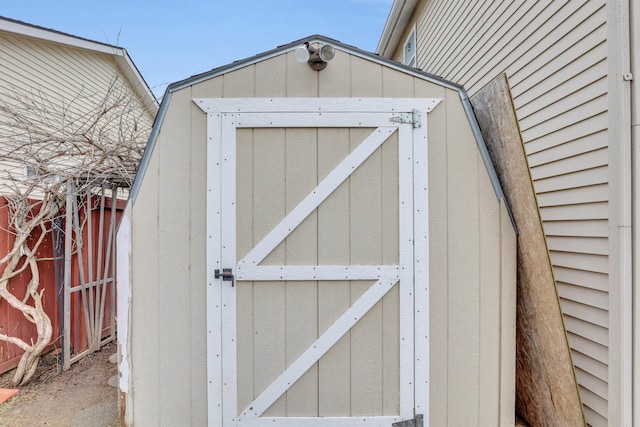 view of shed with fence