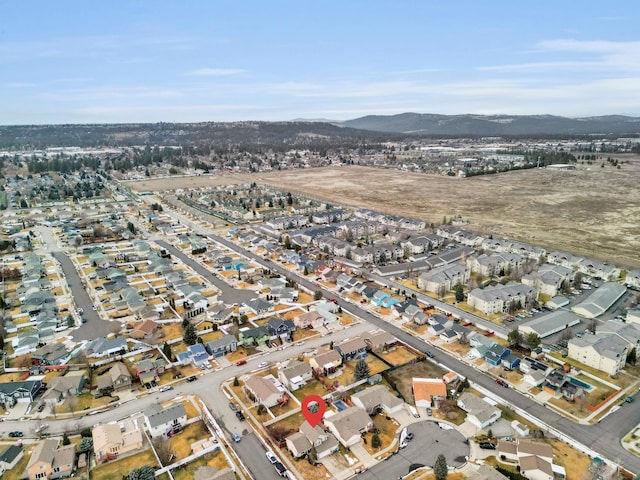 birds eye view of property with a residential view and a mountain view