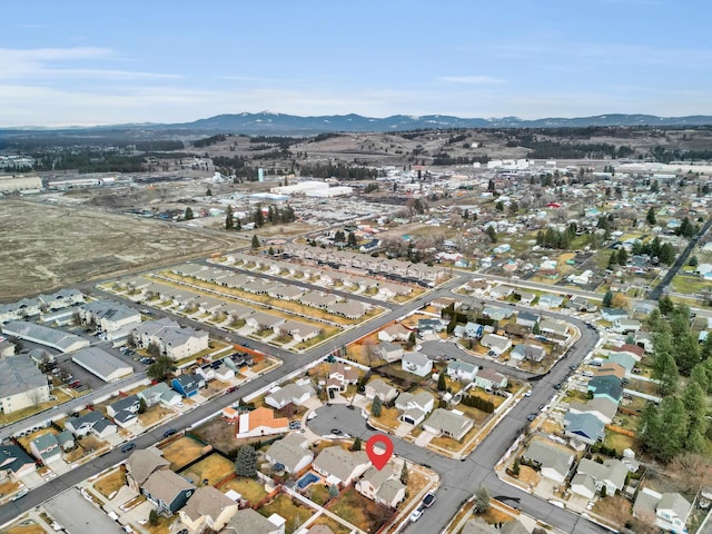 drone / aerial view with a residential view and a mountain view