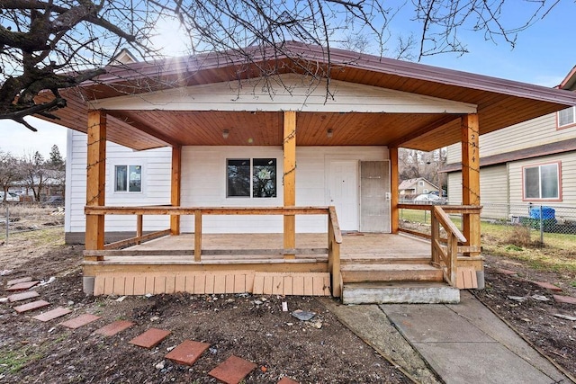 wooden terrace featuring covered porch