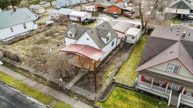 birds eye view of property with a residential view