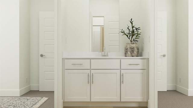 bathroom with baseboards and vanity