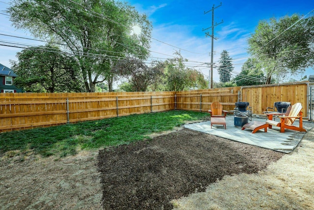 view of yard with a patio area and a fenced backyard