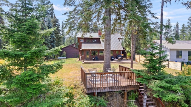 view of yard with fence and a wooden deck