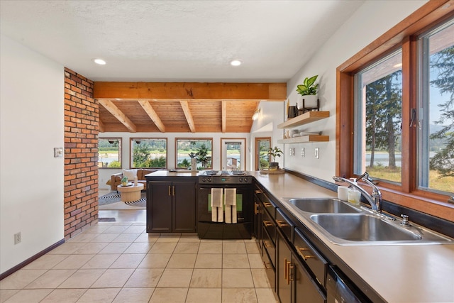 kitchen with light tile patterned floors, baseboards, lofted ceiling with beams, black range, and a sink