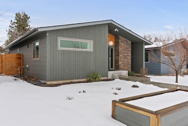 view of front of home featuring fence