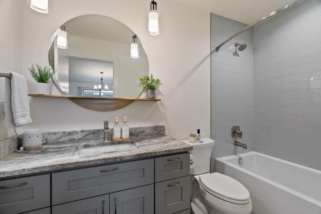 full bathroom with shower / washtub combination, vanity, and toilet