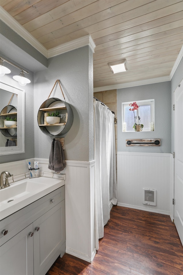 bathroom with a wainscoted wall, crown molding, wood ceiling, vanity, and wood finished floors