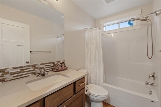 full bath with vanity, shower / bath combo with shower curtain, toilet, and decorative backsplash