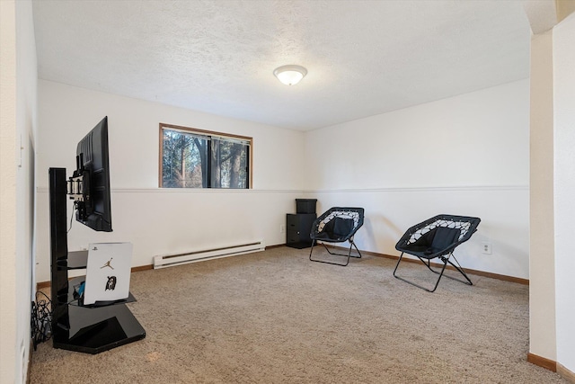 living area with a textured ceiling, baseboards, baseboard heating, and carpet flooring