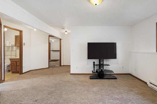 exercise room with carpet, baseboards, a textured ceiling, and baseboard heating