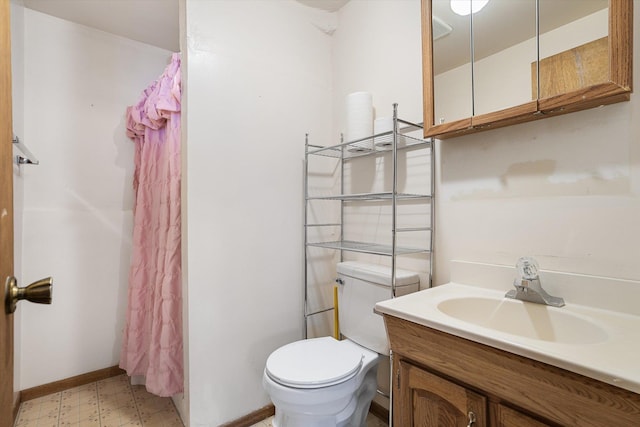 bathroom with visible vents, toilet, vanity, a shower with curtain, and tile patterned floors