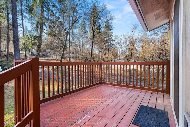 wooden deck with visible vents