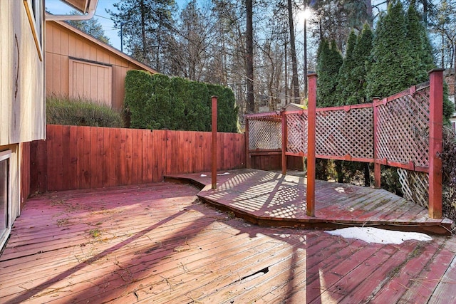 wooden deck featuring fence