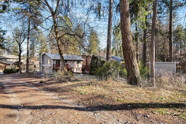 view of front of property featuring a wooden deck