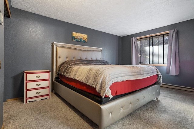 carpeted bedroom featuring baseboards, baseboard heating, a textured ceiling, and a textured wall