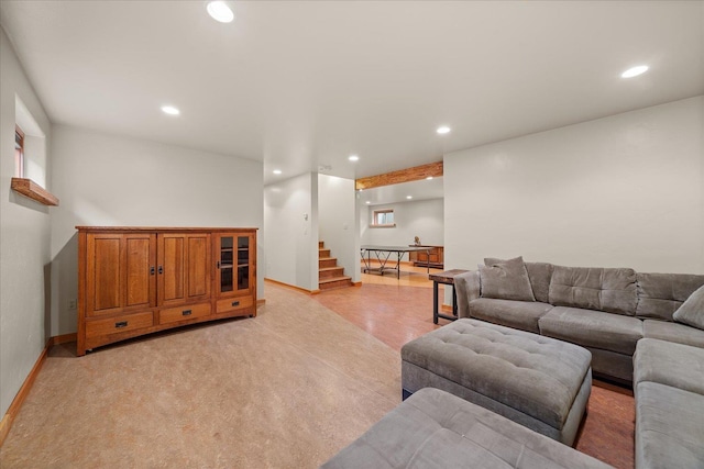 living room with baseboards, stairway, and recessed lighting