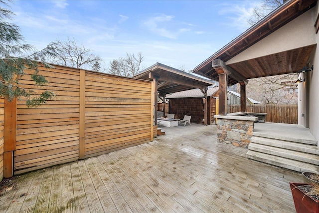 exterior space featuring a fenced backyard and a wooden deck