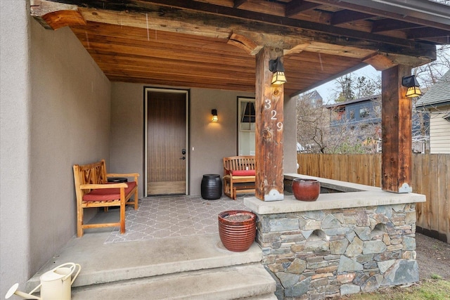 view of patio featuring fence