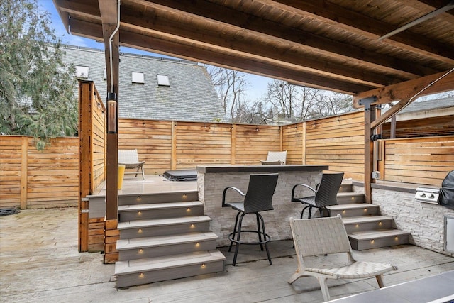 view of patio / terrace with a fenced backyard and outdoor dry bar