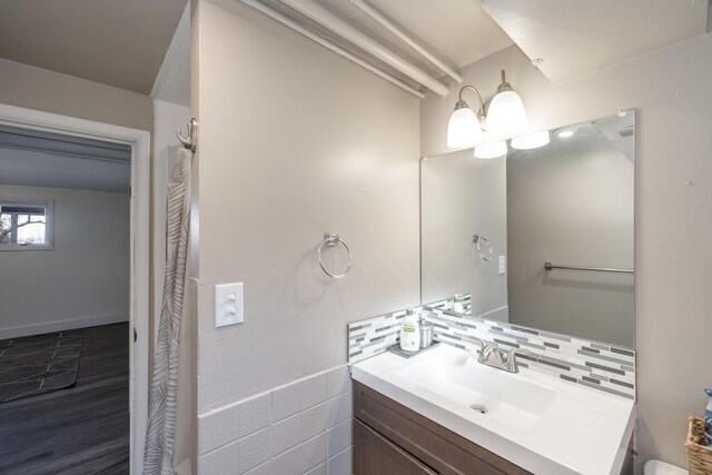 bathroom featuring backsplash and vanity