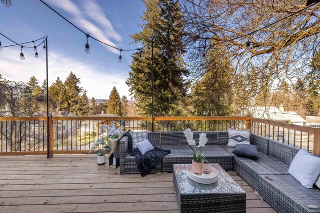 wooden deck featuring outdoor lounge area