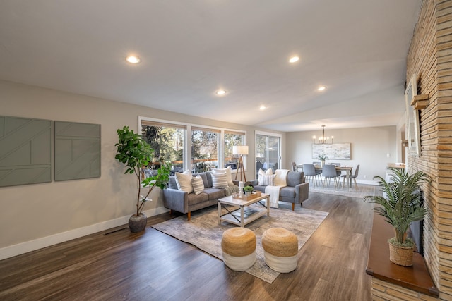 living room with baseboards, vaulted ceiling, wood finished floors, and recessed lighting