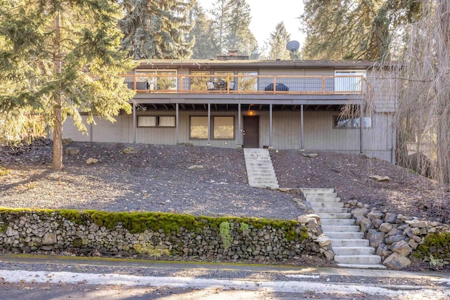 view of front of house with stairs