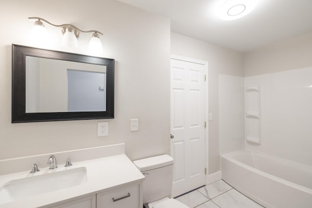 bathroom with toilet, marble finish floor, washtub / shower combination, and vanity