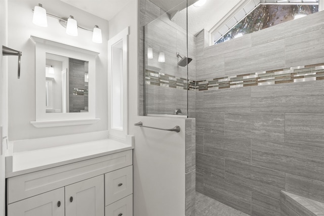 full bathroom featuring vanity and a walk in shower