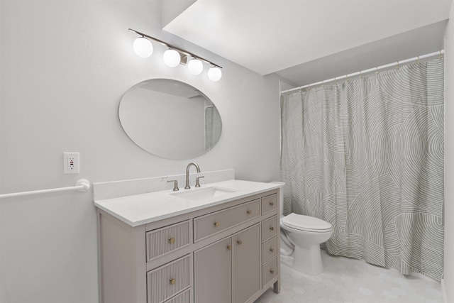 bathroom with toilet, tile patterned floors, curtained shower, and vanity