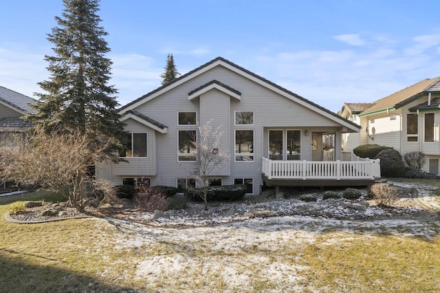rear view of property featuring a deck