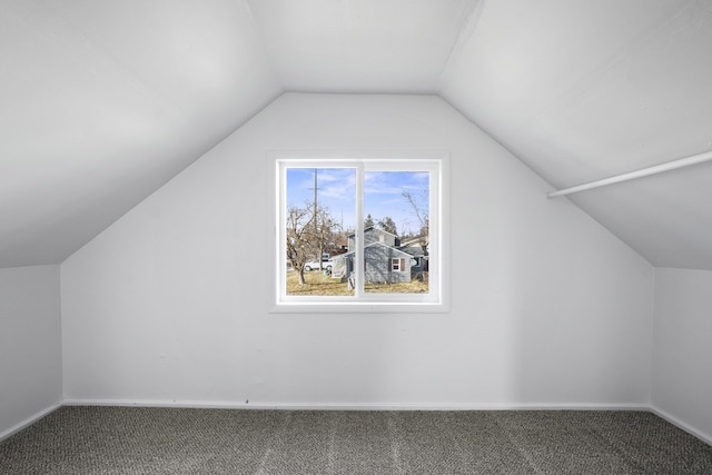 bonus room featuring carpet, vaulted ceiling, and baseboards