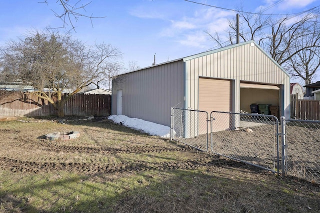 detached garage featuring fence