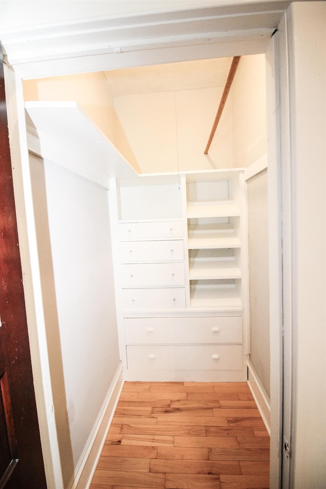 spacious closet featuring light wood-style flooring