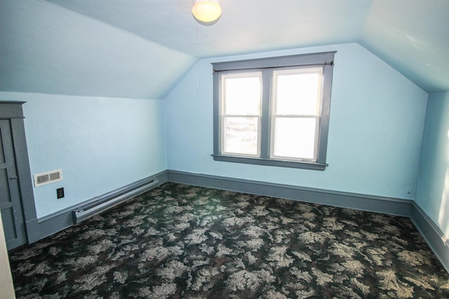 bonus room featuring visible vents, baseboards, vaulted ceiling, and carpet flooring