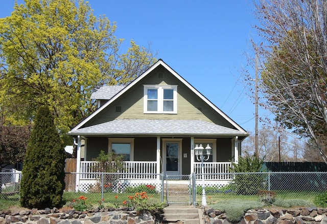 bungalow featuring a porch, a shingled roof, and fence private yard