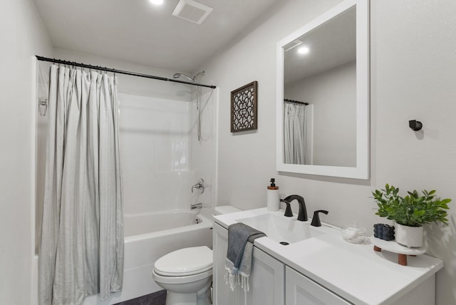 full bath with visible vents, vanity, toilet, and shower / bath combo with shower curtain