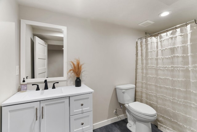 full bath featuring toilet, wood finished floors, vanity, visible vents, and baseboards