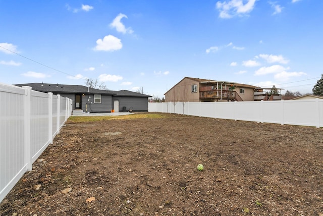 view of yard featuring a fenced backyard