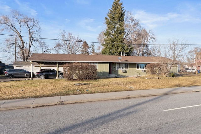 ranch-style house with an attached carport