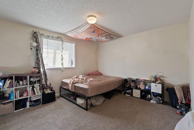 carpeted bedroom with a textured ceiling