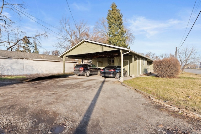 exterior space featuring a carport and driveway