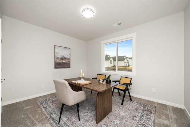 office with baseboards, visible vents, and carpet flooring